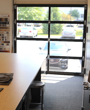 Glass Garage Door Transforms Work Space from Storage Area